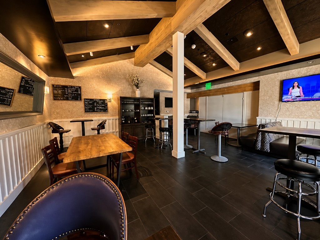 Dining room with booth seating and high-top tables